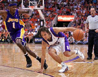 
Phoenix Suns guard Steve Nash tries to get past Smush Paker. 
 (Associated Press / The Spokesman-Review)