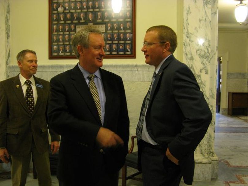 U.S. Sen. Mike Crapo visits with House Majority Caucus Chairman Ken Roberts before addressing the Idaho House on Wednesday. (Betsy Russell)