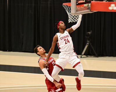 Washington State guard Noah Williams (24) attempts a layup next to Stanford forward Oscar da Silva (13) during the first half of an NCAA college basketball game, Saturday, Feb. 20, 2021, in Pullman, Wash.  (Associated Press)