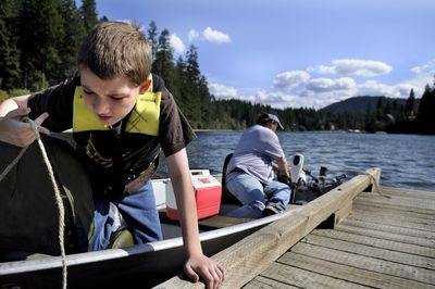 Nine-year-old Jagger Turner took off from the public boat launch at Spirit Lake’s City Beach with his grandfather Michael Benn to do some afternoon fishing on Tuesday. Idaho Fish and Game is considering some improvements to the boat launch.  (Kathy Plonka / The Spokesman-Review)