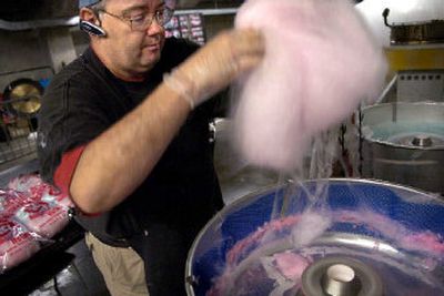 
Mike Means makes cotton candy Tuesday  that he will sell at the Spokane Arena during the State B basketball tournament. 
 (Holly Pickett / The Spokesman-Review)