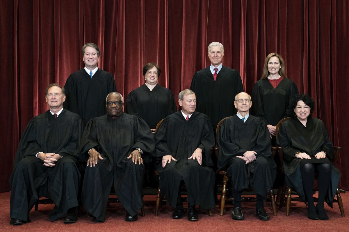 Members of the Supreme Court pose for a group photo April 23 in Washington. Seated from left are Associate Justice Samuel Alito, Associate Justice Clarence Thomas, Chief Justice John Roberts, Associate Justice Stephen Breyer and Associate Justice Sonia Sotomayor, Standing from left are Associate Justice Brett Kavanaugh, Associate Justice Elena Kagan, Associate Justice Neil Gorsuch and Associate Justice Amy Coney Barrett.  (Erin Schaff)