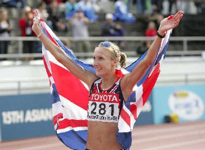 
Britain's Paula Radcliffe takes in the cheers after winning the women's marathon gold medal.
 (Associated Press / The Spokesman-Review)