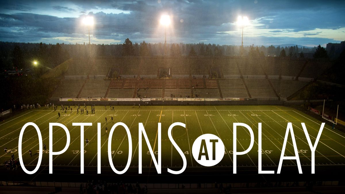 Spectators and players had take cover as a Thunderstorm with lightning delayed the Mt. Spokane vs. Peninsula GSL high school football game, Friday night at Joe Albi Stadium. COLIN MULVANY colinm@spokesman.com (Colin Mulvany / The Spokesman-Review)