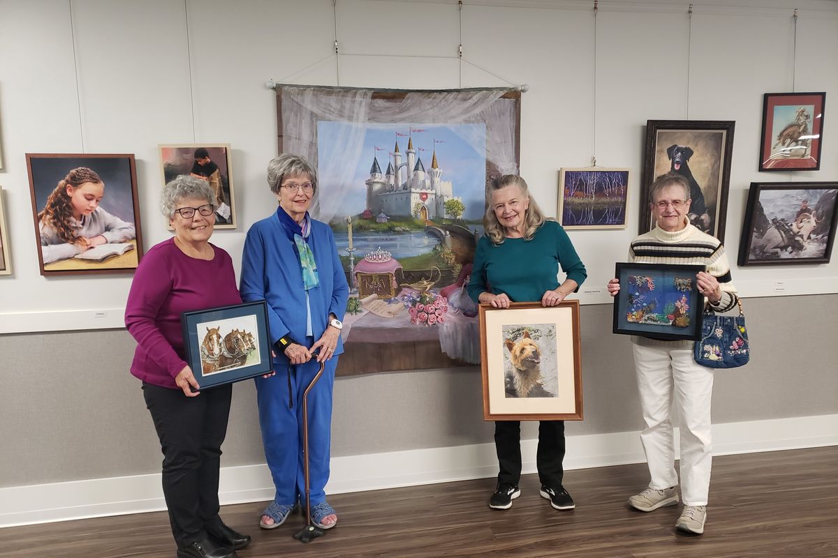 Carol Mellin, left to right, Jackie Volz, Alva Kiesbuy and Jan Krepcik show off their art at Riverview Retirement Community.  (Azaria Podplesky/For The Spokesman-Review)