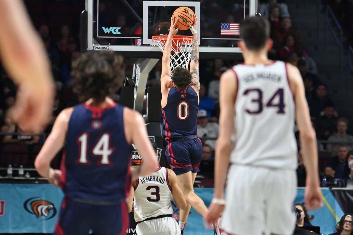 Saint Mary’s guard Logan Johnson dunks against Gonzaga in the West Coast Conference championship game last March in Las Vegas.  (Tyler Tjomsland/The Spokesman-Review)