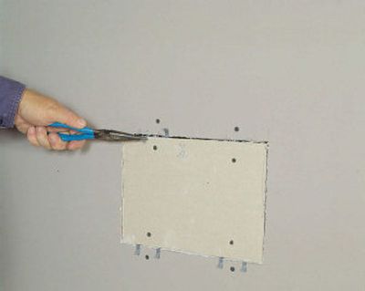 
Repairing holes in drywall is a great skill for do-it-yourselfers.
 (File/Associated Press / The Spokesman-Review)