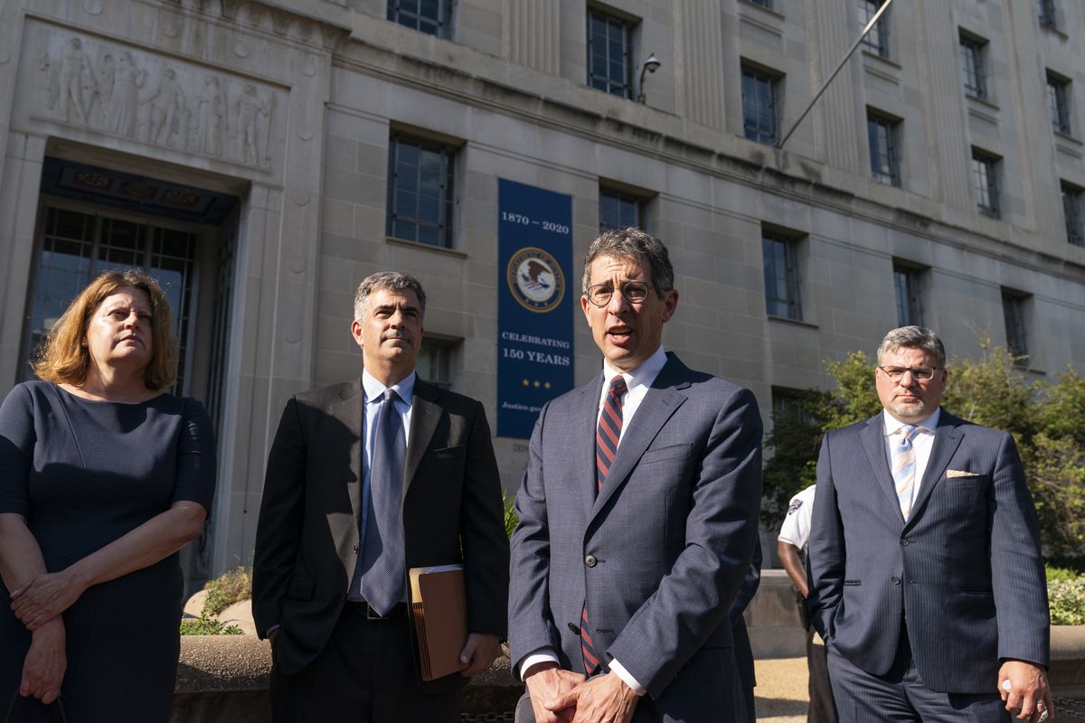 Bruce Brown, third from left, executive director of the Reporters Committee for Freedom of the Press, speaks accompanied by Washington Post Executive Editor Sally Buzbee, left, Washington Post general counsel Jay Kennedy, CNN executive vice president and general counsel David Vigilante, right, after a meeting with Attorney General Merrick Garland at the Department of Justice, Monday, June 14, 2021, in Washington.  (Alex Brandon)