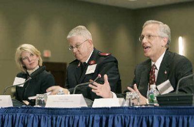 
From left, Catherine Smith, Working Families for Wal-Mart; George Hood, Salvation Army; and Ernie Allen, National Center for Missing and Exploited Children, support Wal-Mart's plan. 
 (Associated Press / The Spokesman-Review)