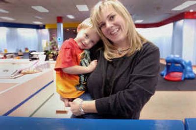 Noelle Wilson holds her two year old son Bryce at her child care business at the NorthTown Mall. Wilson and her husband own and operate Drop In and Play where parents can drop off their kids before shopping.
(Christopher Anderson photos/ / The Spokesman-Review)