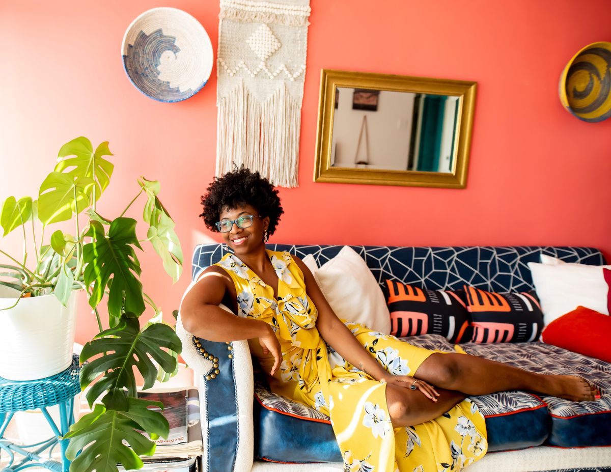 Nicole Crowder sitting on one of her modern furniture and upholstery designs.  (Danielle Finney/Handout)