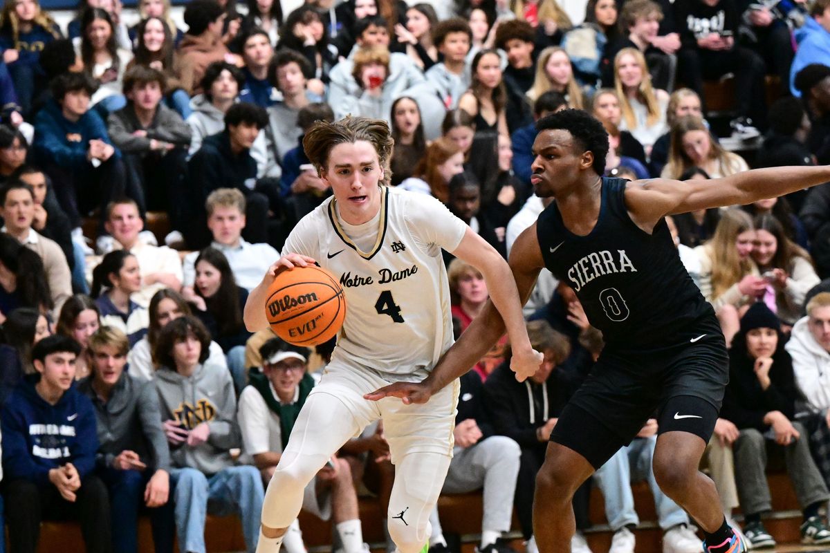 Sherman Oaks Notre Dame’s Dusty Stromer drives against Sierra Canyon’s Bronny James, son of NBA star LeBron James, during a high school basketball game on Friday in Sherman Oaks, Calif.  (Tyler Tjomsland / The Spokesman-Review)