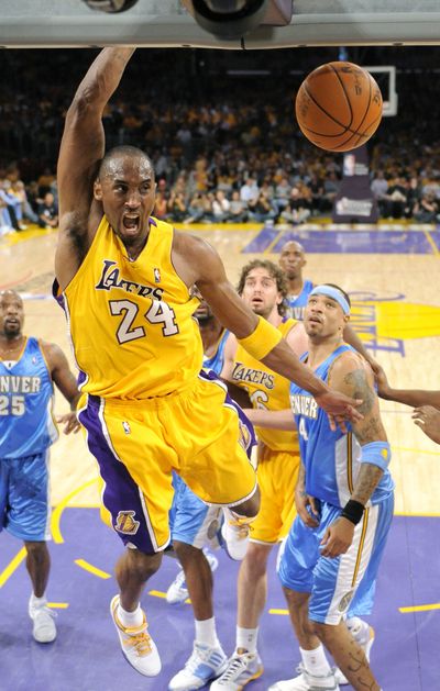 Lakers guard Kobe Bryant dunks the ball during first-half action Tuesday.  (Associated Press / The Spokesman-Review)