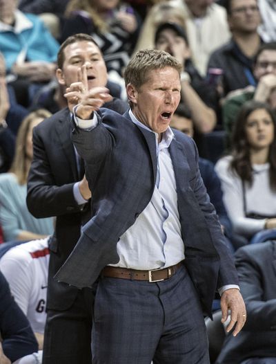 Gonzaga coach Mark Few, right and Tommy Lloyd weren’t too pleased with a jump-ball call during the Akron game on Dec. 10. Against Tennessee on Sunday, Few was called for his first technical since 2013. (Dan Pelle / The Spokesman-Review)
