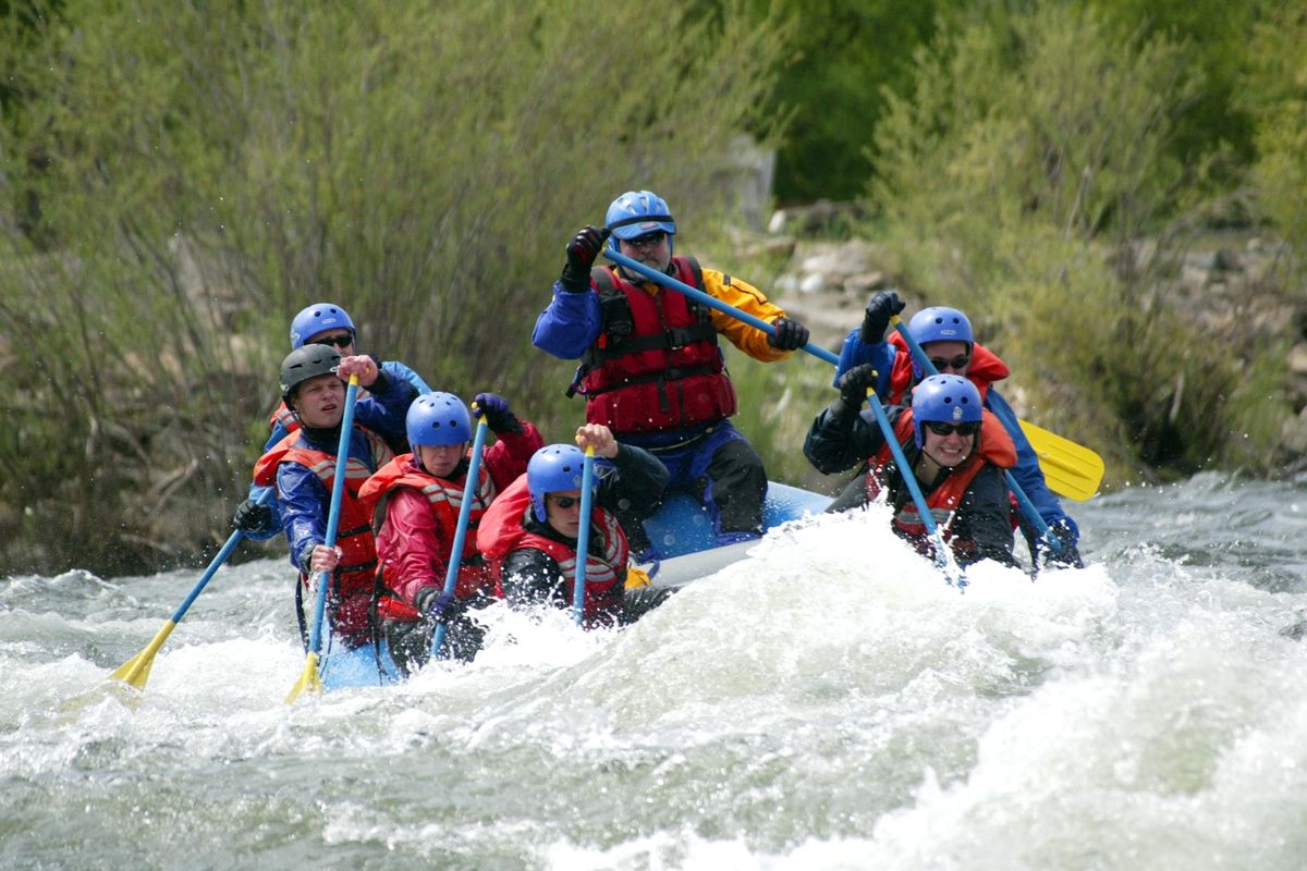 Paul Green, professor of outdoor recreation at Eastern Washington University, leads whitewater rafting students down the Spokane River.