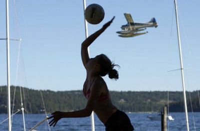 
Kaylen Meredith serves during last year's the Hot Foot Classic beach volleyball tournament. This year's event starts today at 8 a.m. and continues through Sunday  at NIC beach volleyball area.
 (File / The Spokesman-Review)