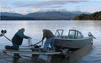 
After a day of salmon fishing, Al Bahr, left, and Ken Scherting pull their boat out of Hood Canal on Nov. 27 in Union, Wash. A series of buoys continually monitors water and atmospheric conditions in various parts of the canal. Associated Press
 (Associated Press / The Spokesman-Review)