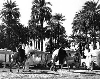 
Members of the Wally Byam Airstream Caravan Club take time out for a camel ride at an oasis camp site during the club's 1959-60 Capetown to Cairo adventure.
 (Photo by Pete Turner, courtesy of Airstream Inc. / The Spokesman-Review)