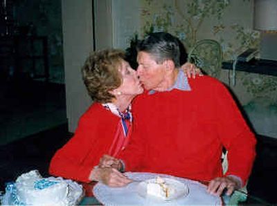 
Former President Ronald Reagan is kissed by his wife, Nancy, in this photo made inside their Bel-Air home in Los Angeles, Feb. 6, 2000, on Reagan's 89th birthday. 
 (Associated Press / The Spokesman-Review)