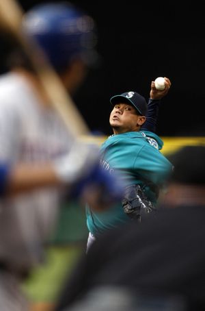 Seattle Mariners pitcher Felix Hernandez throws in the first inning against Texas Rangers' Ian Kinsler during a baseball game in Seattle on Monday, May 21, 2012. (Kevin Casey / Fr132181 Ap)