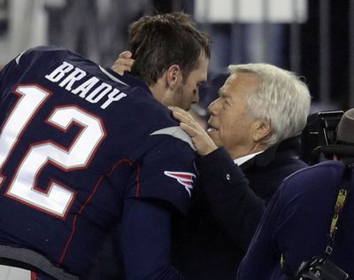 New England Patriots quarterback Tom Brady (12) greets team owner Robert Kraft before the AFC championship NFL football game against the Pittsburgh Steelers. Neither man is high on Norman Chad’s guest list for the Super Bowl. (Charles Krupa / Associated Press)