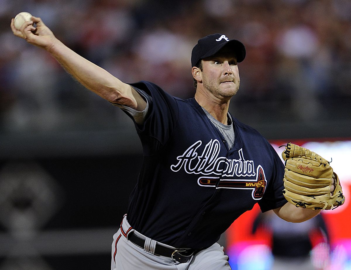 Derek Lowe was sharp in his first outing with the Braves, allowing two hits and no runs in eight innings.   (Associated Press / The Spokesman-Review)