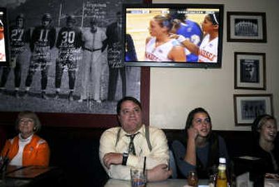
Deanna Ranniger, Steve Ranniger, Jami Bjorklund and Alissa Lanker, at Heroes and Legends, watch Tennessee's Angie Bjorklund – Jami's sister – play Thursday. Jamie and her Gonzaga University team will take on Angie and the Lady Volunteers on Sunday. 
 (Dan Pelle / The Spokesman-Review)