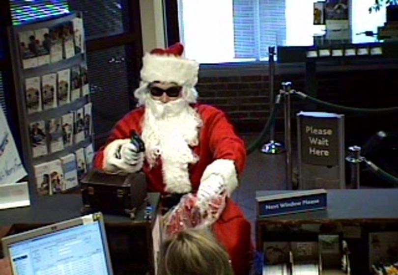 This Tuesday, Dec. 22, 2009 image made from video released by the Metropolitan Nashville Police Department shows a man dressed as Santa robbing the Sun Trust Bank in Nashville, Tenn. (AP Photo/Metropolitan Nashville Police Department) (AP/Metropolitan Nashville Police Department)