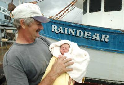 
Shrimp boat Capt. Ed Kiesel holds Brian Edward Mawhorr outside his boat in Freeport, Texas. Associated Press
 (Associated Press / The Spokesman-Review)