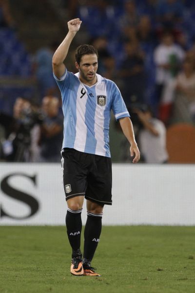 Forward Gonzalo Higuain celebrates after giving Argentina a 1-0 lead over Italy in the 20th minute of an eventual 2-1 victory. (Associated Press)