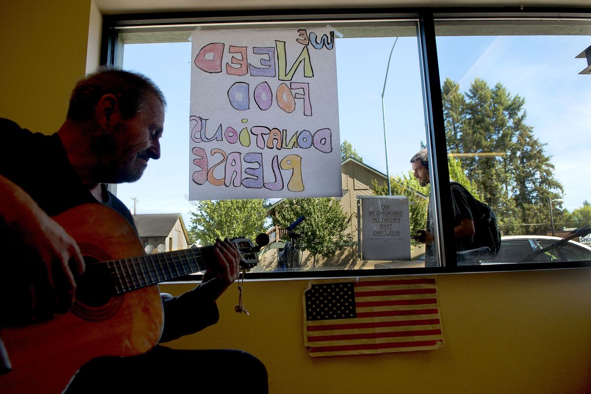 “I’m homeless right now,” Kenneth “Pops” Frank said Wednesday as he played guitar at St. Vincent de Paul’s Fresh Start drop-in center on East Sherman Avenue in Coeur d’Alene. The city is leading a discussion on how to revitalize the corridor, which includes bars, restaurants, transitional housing and a mix of retail shops. (Kathy Plonka)