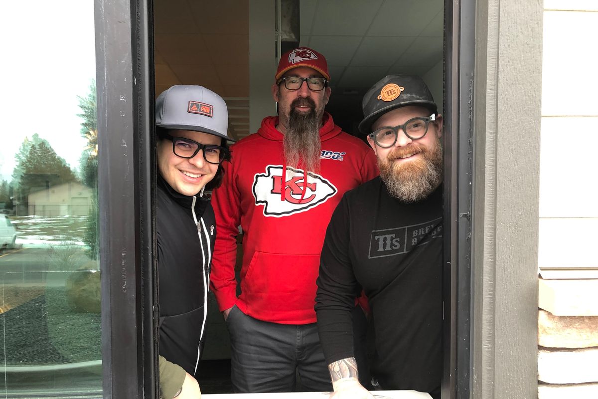 Ramsey Pruchnic, Travis Thosath and Chad White stand in the drive-thru window of the former Hello Sugar in Spokane Valley on Monday. The location is the future site of taco shop Uno Mas, set to open in March.  (Don Chareunsy/The Spokesman-Review)