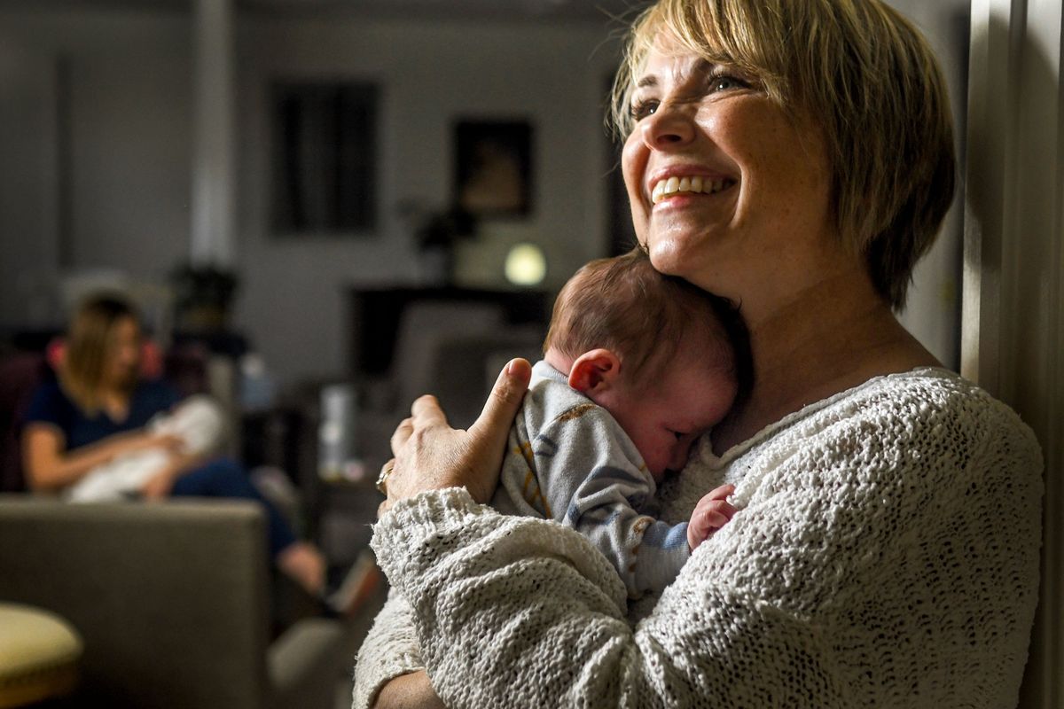 Maddie’s Place founder Tricia Hughes holds 3-week-old Elizabeth at the care facility in Spokane on Thursday, Oct. 27, 2022.  (Kathy Plonka/The Spokesman-Review)