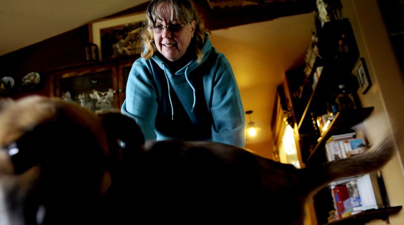 Kathleen Callahan with her dog Charlee at her home in Athol on Thursday, April 29, 2010. (Kathy Plonka / The Spokesman-Review)