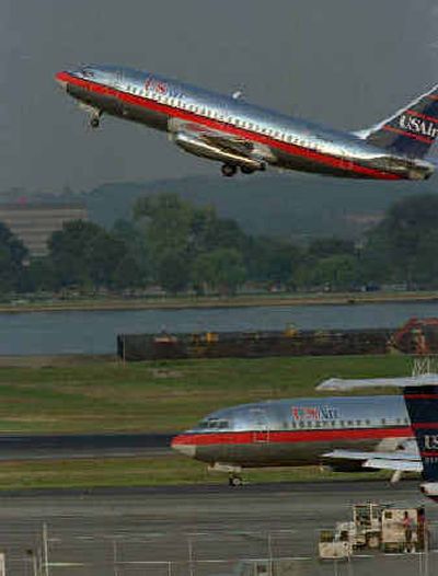 
 A USAir jet takes off from Washington National Airport as another jetliner taxis to the terminal. Decisions by federal officials are expected to help shape the future of the industry in the coming months. 
 (File/Associated Press / The Spokesman-Review)