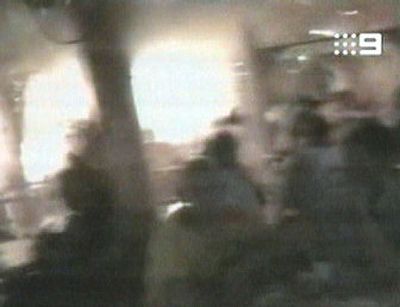 
The explosion at a café in Kuta, Bali, Indonesia, is shown in this image taken from an amateur video. Moments earlier, a man of local appearance wearing a backpack entered the area to rear left. It was one of three suicide bombings on the Indonesian resort island of Bali Saturday night, killing 26 people and wounding 101. 
 (Associated Press / The Spokesman-Review)