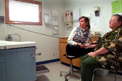 
Dr. Sid Titus, left, takes Holly Abey's blood pressure in an exam room at the Dirne Community Health Center in Coeur d'Alene, which is planning to start up at clinic just for geriatric patients. 
 (Jesse Tinsley / The Spokesman-Review)