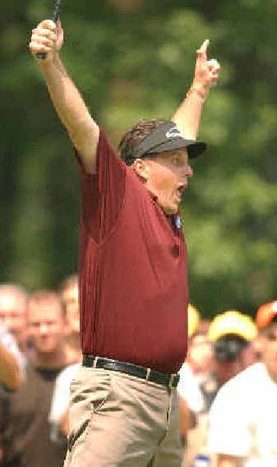 
Phil Mickelson celebrates putt in Exelon Invitational that he won on Monday. 
 (Associated Press / The Spokesman-Review)