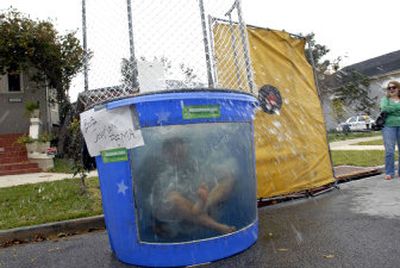 
 Bob Josephson, FEMA's director of intergovernmental affairs in Louisiana,  plunges into a dunking booth at the Broadmoor Neighborhood Festival in New Orleans. 
 (Associated Press / The Spokesman-Review)