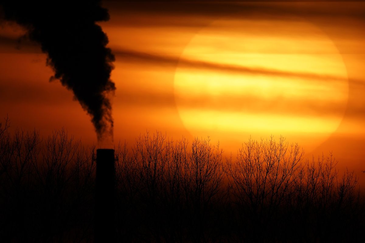 FILE - In this Monday, Feb. 1, 2021 file photo, emissions from a coal-fired power plant are silhouetted against the setting sun in Independence, Mo. A United Nations report released on Thursday, Feb. 18, 2021 says humans are making Earth a broken and increasingly unlivable planet through climate change, biodiversity loss and pollution. So the world must make dramatic changes to society, economics and daily life.  (Charlie Riedel)