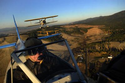 
Jeff Hamilton flies his 1942 Stearman biplane over East Spokane on Oct. 26 along with Dave Holmes and Jay Pemberton. 
 (Photos by JED CONKLIN / The Spokesman-Review)