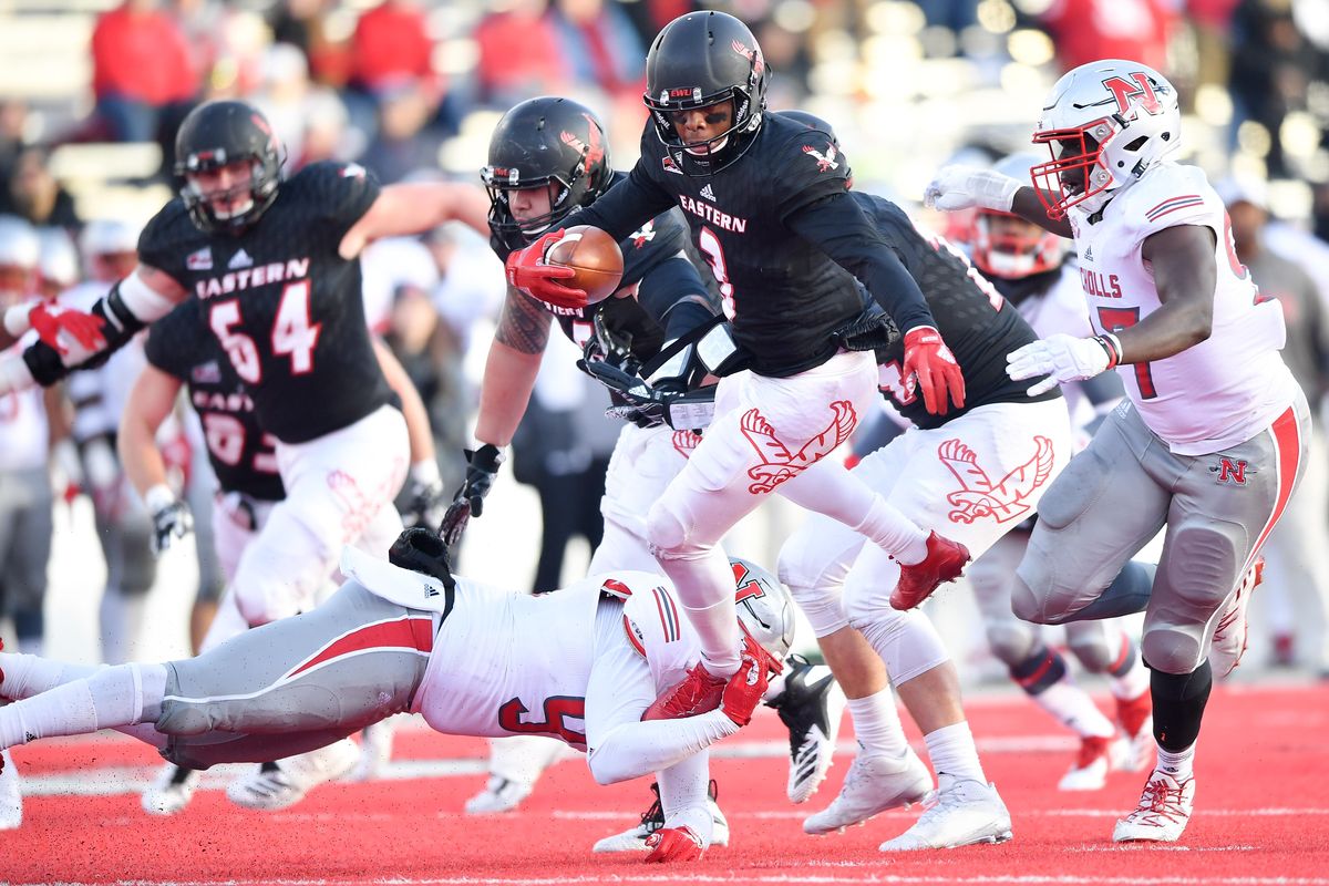 Eastern Washington Eagles quarterback Eric Barriere (3) leaps through the Nicholls State Colonels defense during the first half of a college football game on Saturday, December 1, 2018, at Roos Field in Cheney, Wash. (Tyler Tjomsland / The Spokesman-Review)