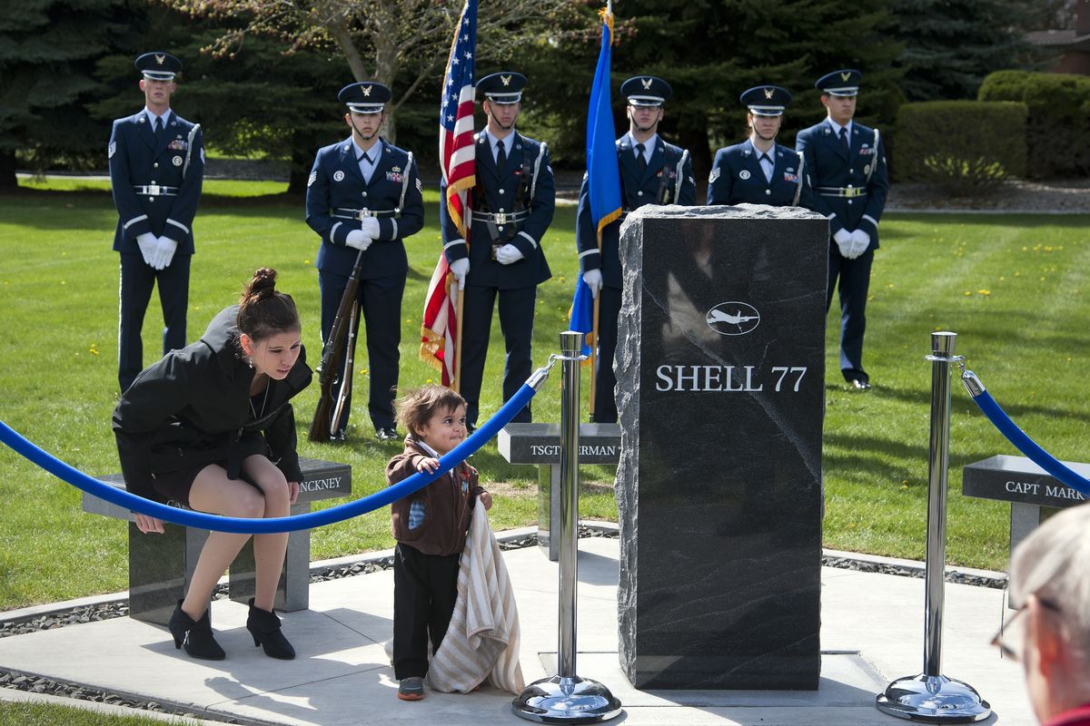 Gabriel Pinckney, 19 months, visits the Shell 77 Memorial with his aunt, Samantha Castro, moments before the dedication on Saturday. Gabriel’s mother, Capt. Victoria “Tory” Pinckney, was one of three airmen killed in a KC-135 crash last May. (Dan Pelle)