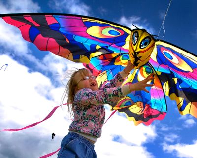 With her mom Jennifer Cubley on the other end of the line, Kelly-anne Cubley, age 7, helps launch their kite into the wind during the Family Fun Kite Festival at the South Side Soccer Complex in April 2005.  (COLIN MULVANY/The Spokesman-Review)