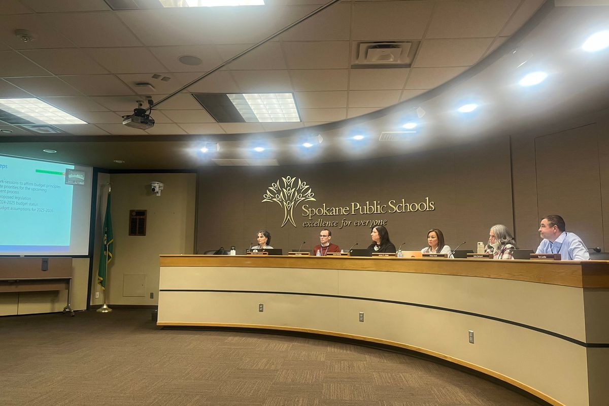 The Spokane Public Schools board at its regular meeting on Wednesday, Dec. 18, shown after approving a $12.2 million property purchase in the University District. From Left, Board President Nikki Otero Lockwood, Vice President Mike Wiser, Nicole Bishop, Jenny Slagle, Hilary Kozel and Superintendent Adam Swinyard. (Elena Perry/THE SPOKESMAN-REVIEW)