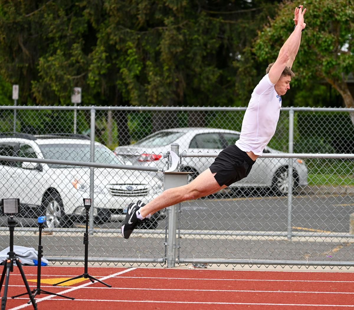 Former Boise State University track athlete Braden Mitchell leaps 10 feet, 7 inches in the standing long jump during testing for the USA Bobsled and Skeleton combine on Saturday at Shadle Park High School.  (DAN PELLE/FOR THE SPOKESMAN-REVIEW)