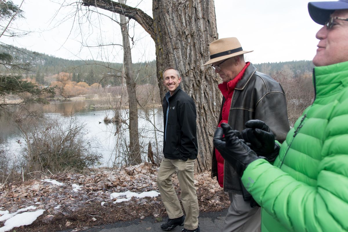 Mike Schmeltzer (right), Rob Allen and Chris Zeller walk near the Little Spokane River. For decades the 112 acres have been used as an informal urban park by Fairwood neighborhood residents. Now Fish and Wildlife is trying to surplus the property. Allen and others hope the land can be incorporated into the Riverside State Park boundary. (Eli Francovich / The Spokesman-Review)