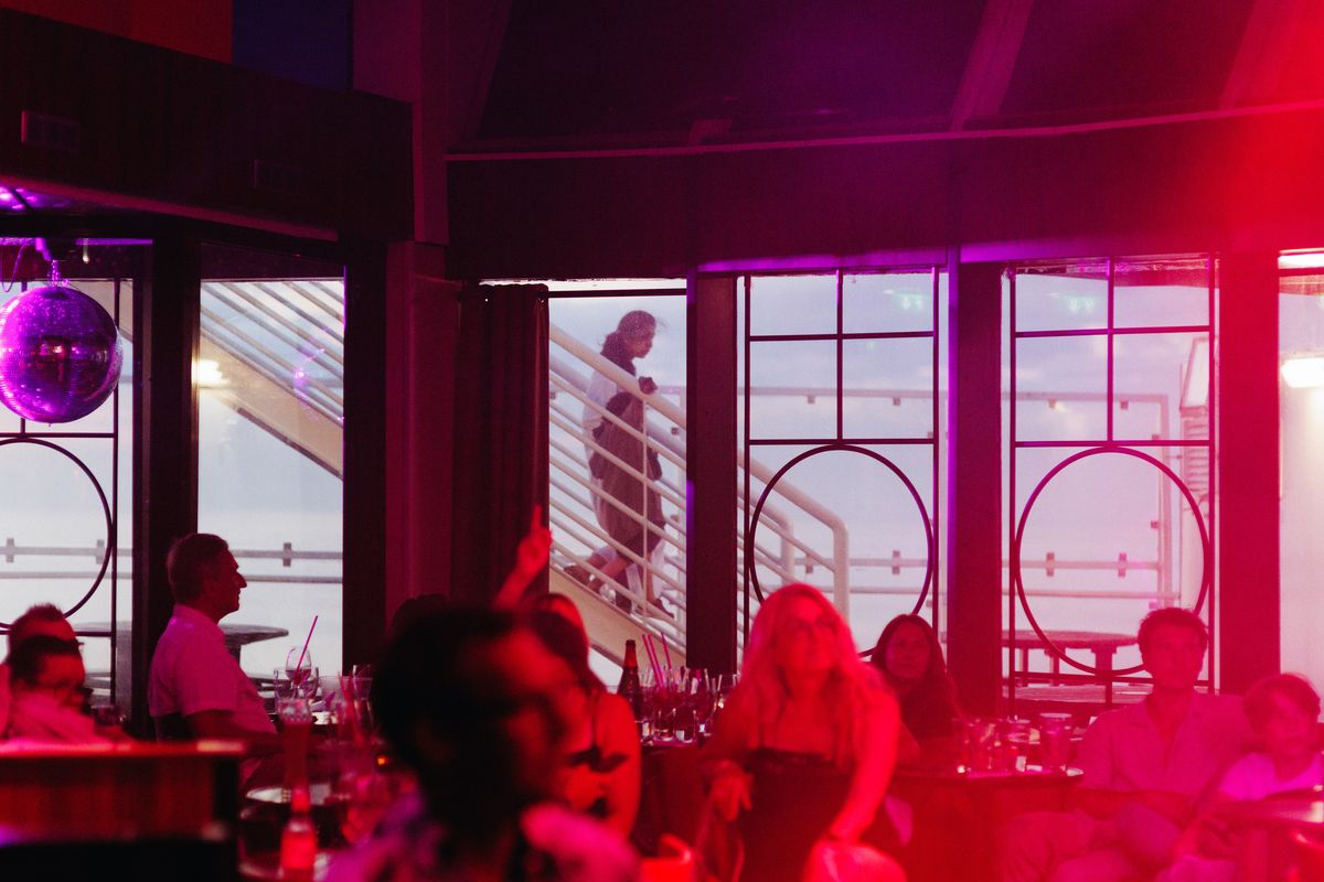 The karaoke bar on the M/S Gabriella, a ferry that sails between Stockholm and Helsinki, in Helsinki, July 24, 2024. The 16-hour trip between the two northern European cities is a festive summer ritual, with plenty of singing, gambling, limbo contests and maybe a bit too much to drink.  (New York Times)