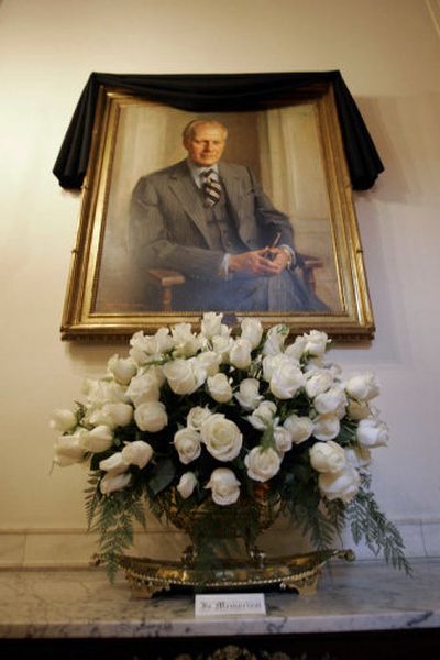 
A black sash placed by White House staff hangs over the official portrait of late President Gerald Ford in the Cross Hall of the White House in Washington, D.C., on Thursday. 
 (Associated Press / The Spokesman-Review)