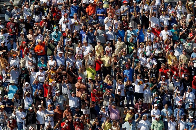 The fans salute Dale Earnhardt on lap 3 by holding up three fingers during the Daytona 500 at Daytona International Speedway at Daytona Beach, Fla. (Photo Credit: Todd Warshaw/Getty Images for NASCAR) (Todd Warshaw / Getty Images North America)